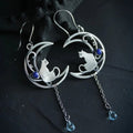 Blue Zirconia Cat Earrings in Silver